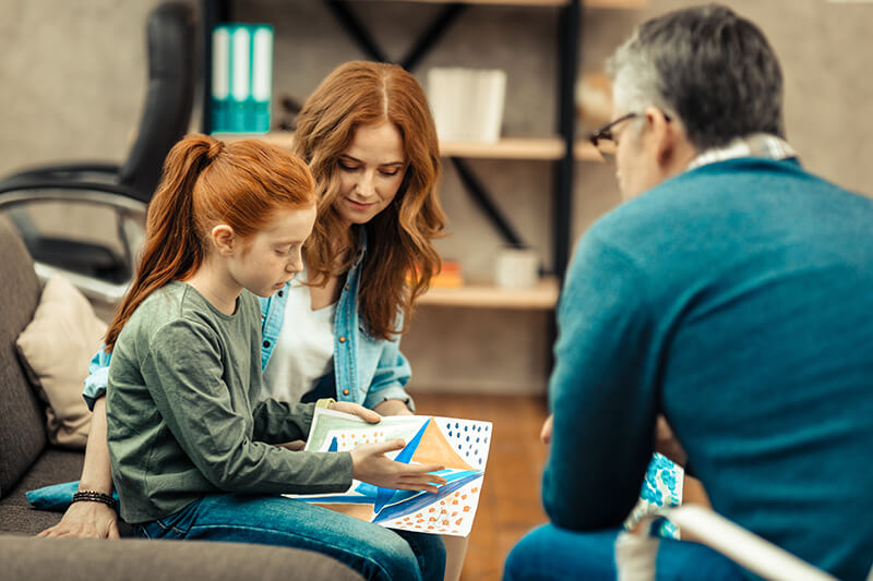 Girl and mother in consult